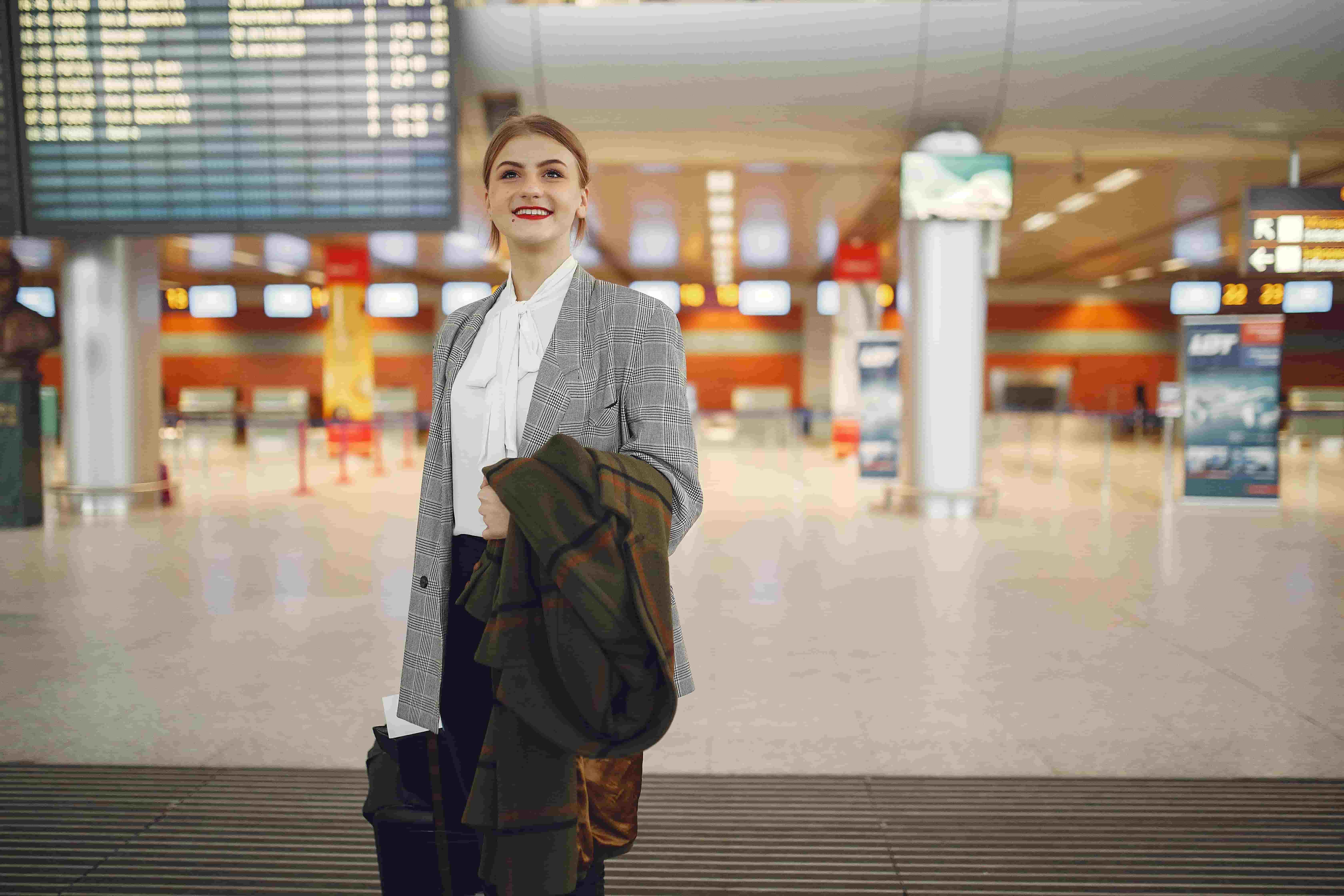Successful applicant at airport ready to travel